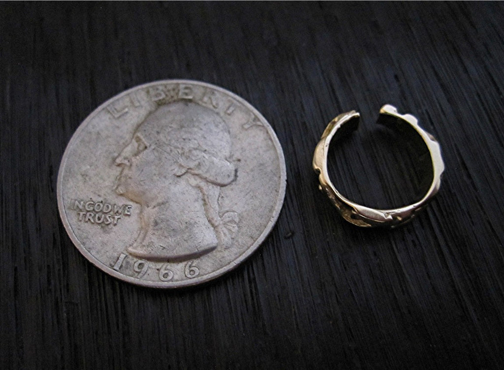 VDI Jewelry Findings Gold Bronze Artisan Designed Jump Ring next to quarter