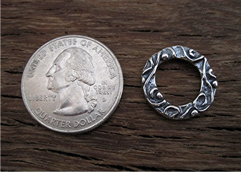 VDI Jewelry Findings Textured Jewelry Link and Connector Next to a Quarter