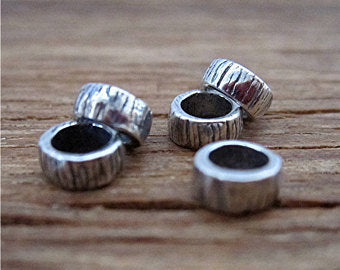 Two Tiny Lined Artisan Beads and Spacers in Sterling Silver (one pair)