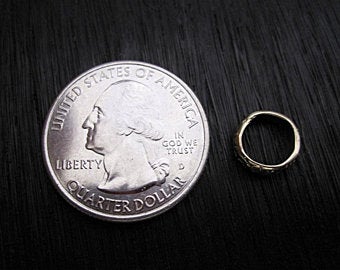 Gold Bronze Hammered Textured Jewelry Link next to a Quarter