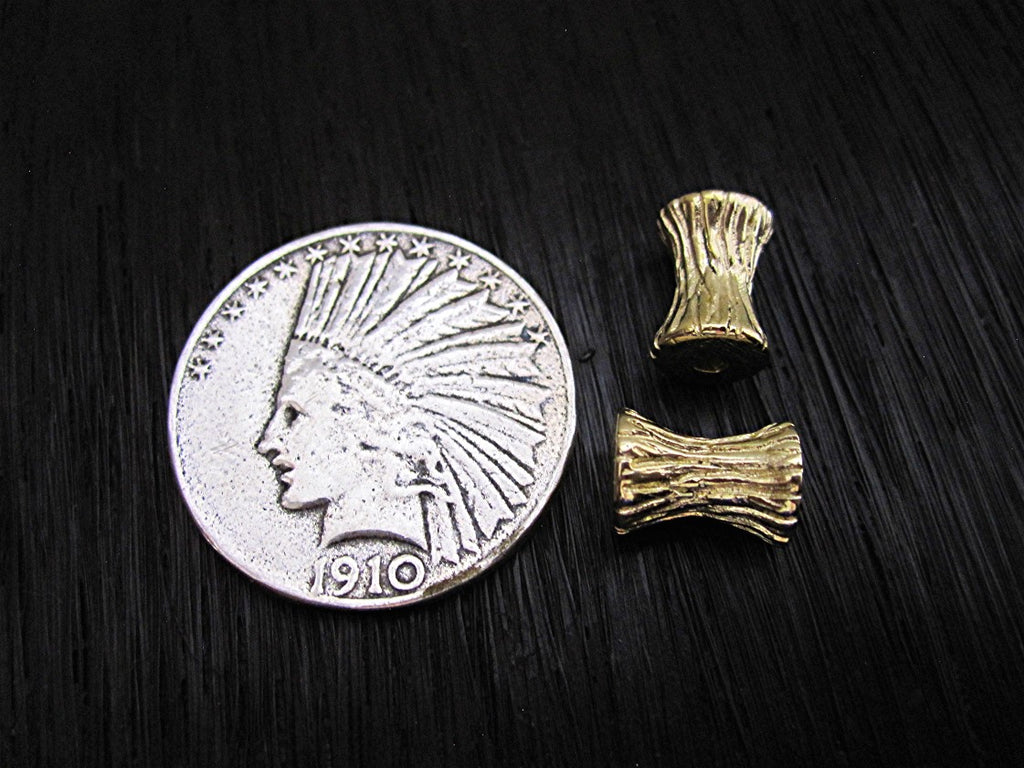 Gold Bronze Textured Concave Bead and Slider next to a Quarter