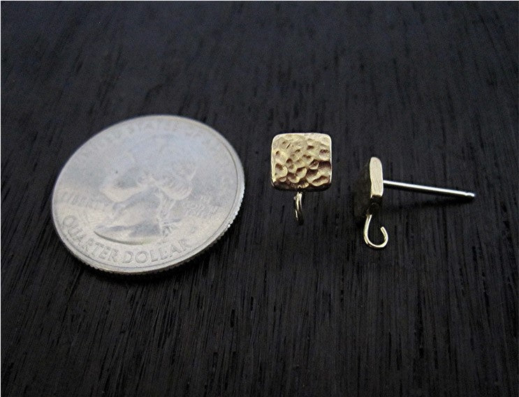 VDI Jewelry Findings Gold Bronze Square Textured Earring Posts next to a quarter