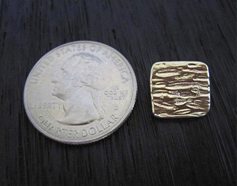 VDI Jewelry Findings Wood Bark Textured Gold Bronze Button and Jewelry Clasp next to a quarter