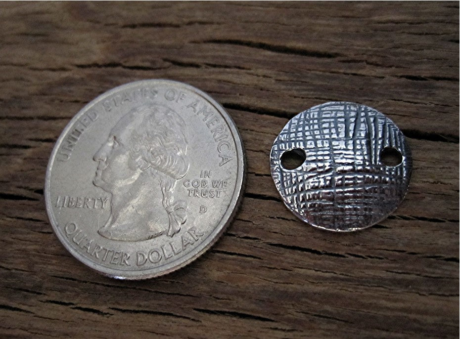 Sterling Silver Round Textured Jewelry Link next to a Quarter