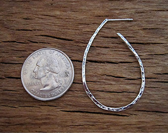 VDI Jewelry Findings Sterling Silver Hammered Hoop Earrings Next to a Quarter