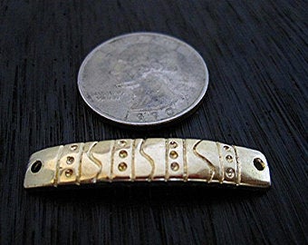 Gold Bronze Bracelet Link next to a quarter